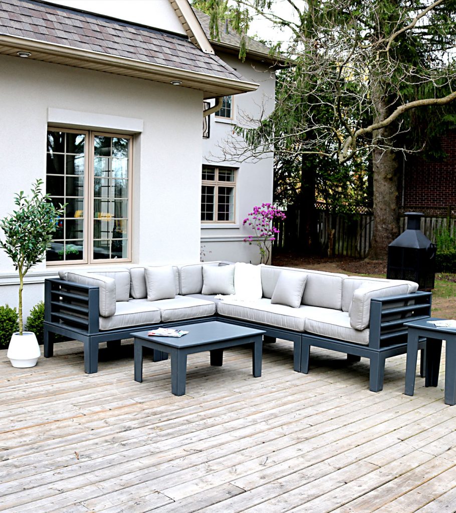 Outdoor couch with coffee table and end table on a deck